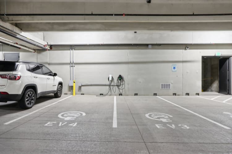 Milwaukee County apartments for rent - image - A white car is parked in a parking space with the label EV4