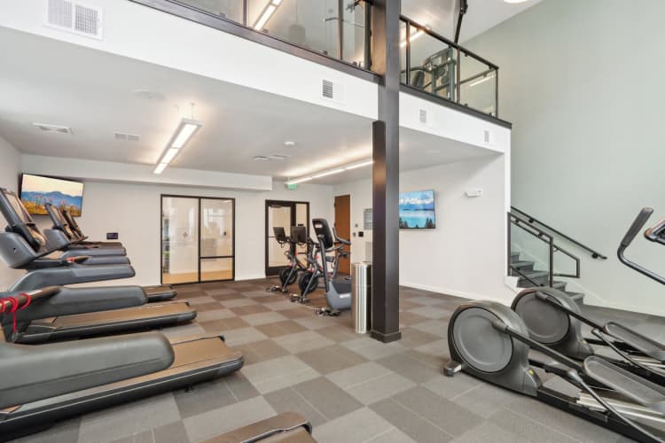 Milwaukee County apartments for rent - image - A gym with treadmills, exercise bikes and a staircase