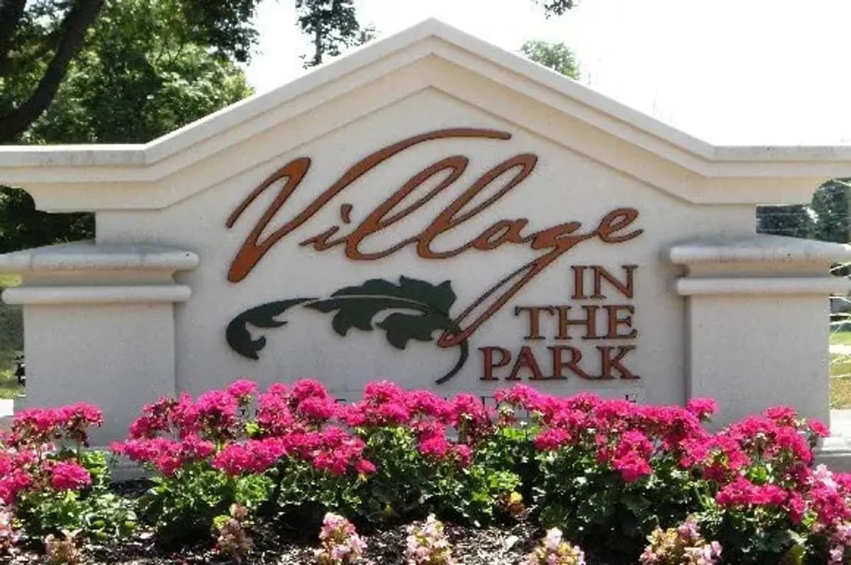 undefined apartments for rent - image - wi-greendale-villageinthepark-p0108216-01-sign-with-flowers-resized-1-photogallery_orig.jpg