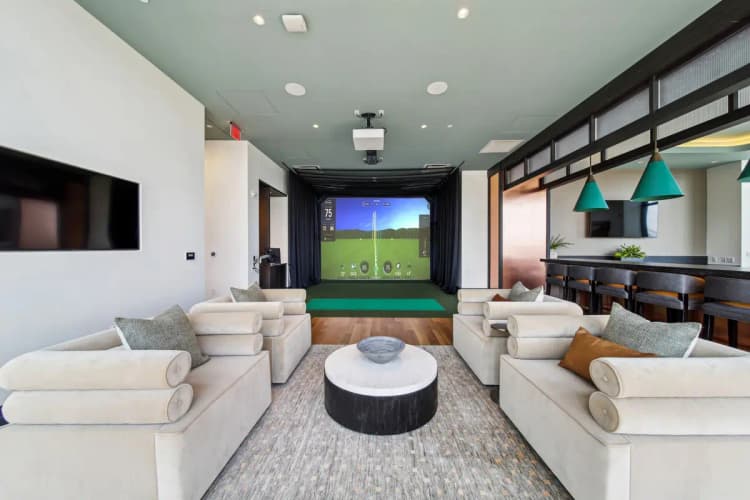 undefined apartments for rent - image - 333Water_Int_Amenity_GolfSimulatorLounge_July2024_kc-1-1.jpg
