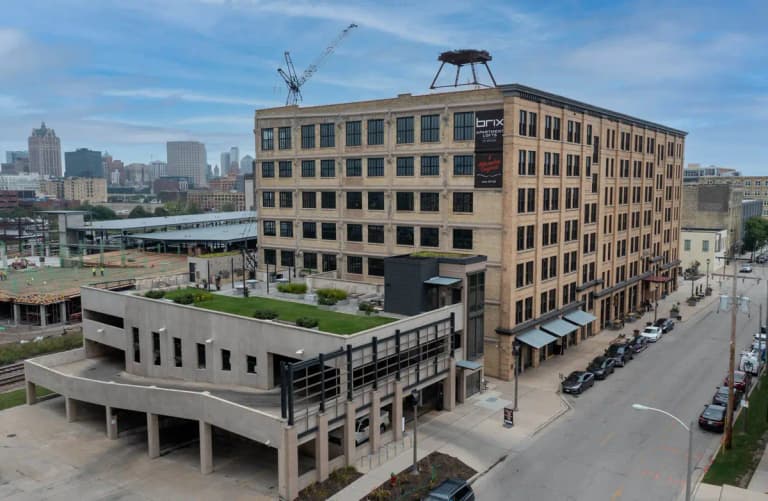 undefined apartments for rent - image - Exterior-Parking-Garage-and-Community-Skyline.jpg