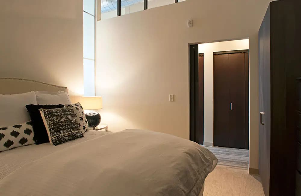 undefined apartments for rent - image - One-Bedroom-Model-Large-Bedroom-With-Transom-Window-And-Built-In-Wardrobes.jpg